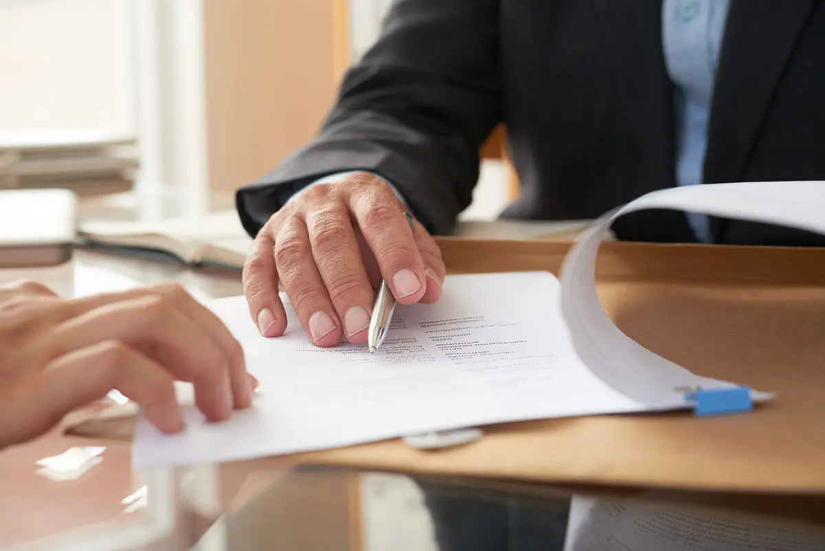 Professional discussing probate paperwork, guiding family.
